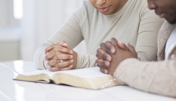 A couple and family receiving Christian marriage and family counseling